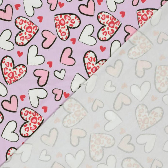 Baumwolljersey Leo Herzen auf rosa *Ab 50cm